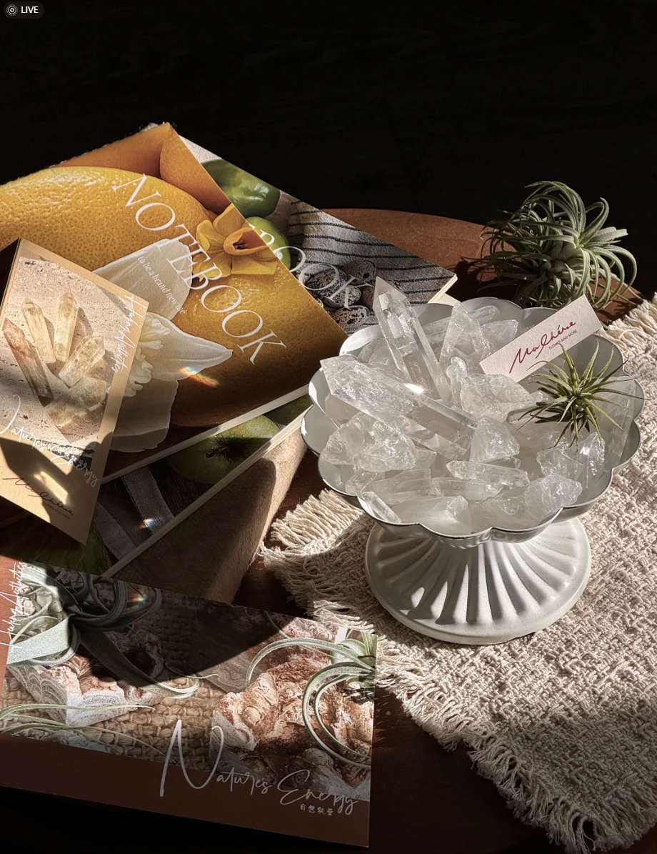 Handcrafted clear quartz crystal bowl on raw textured fabric